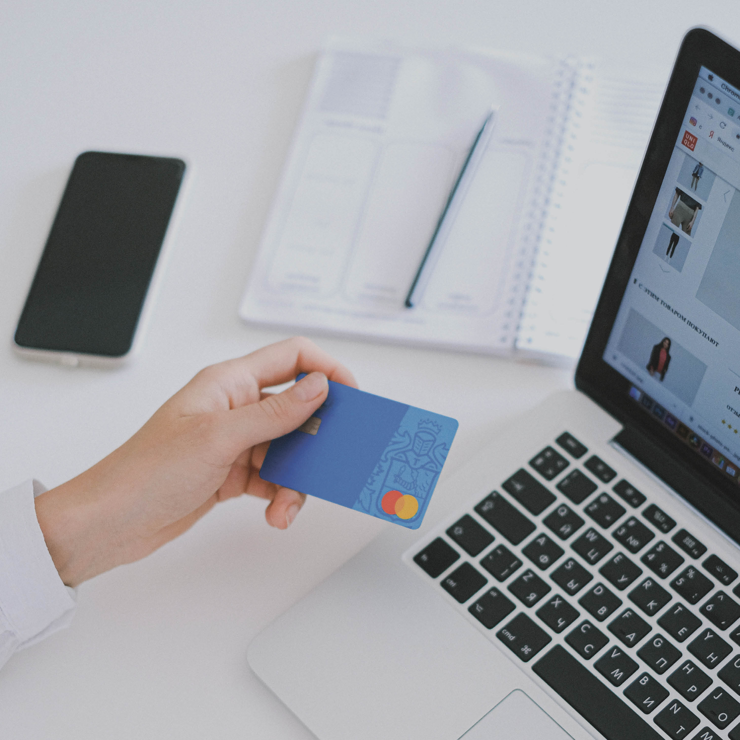 Photo of person holding a credit card
