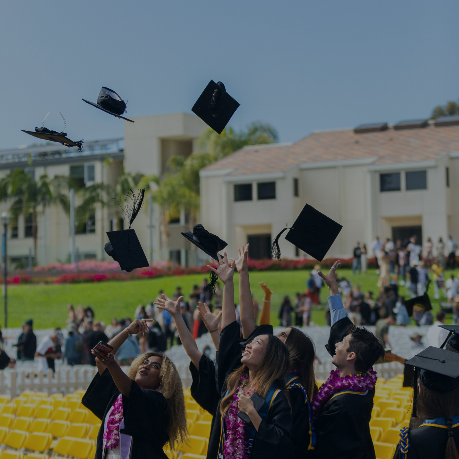 UCSB graduates throwing their caps
