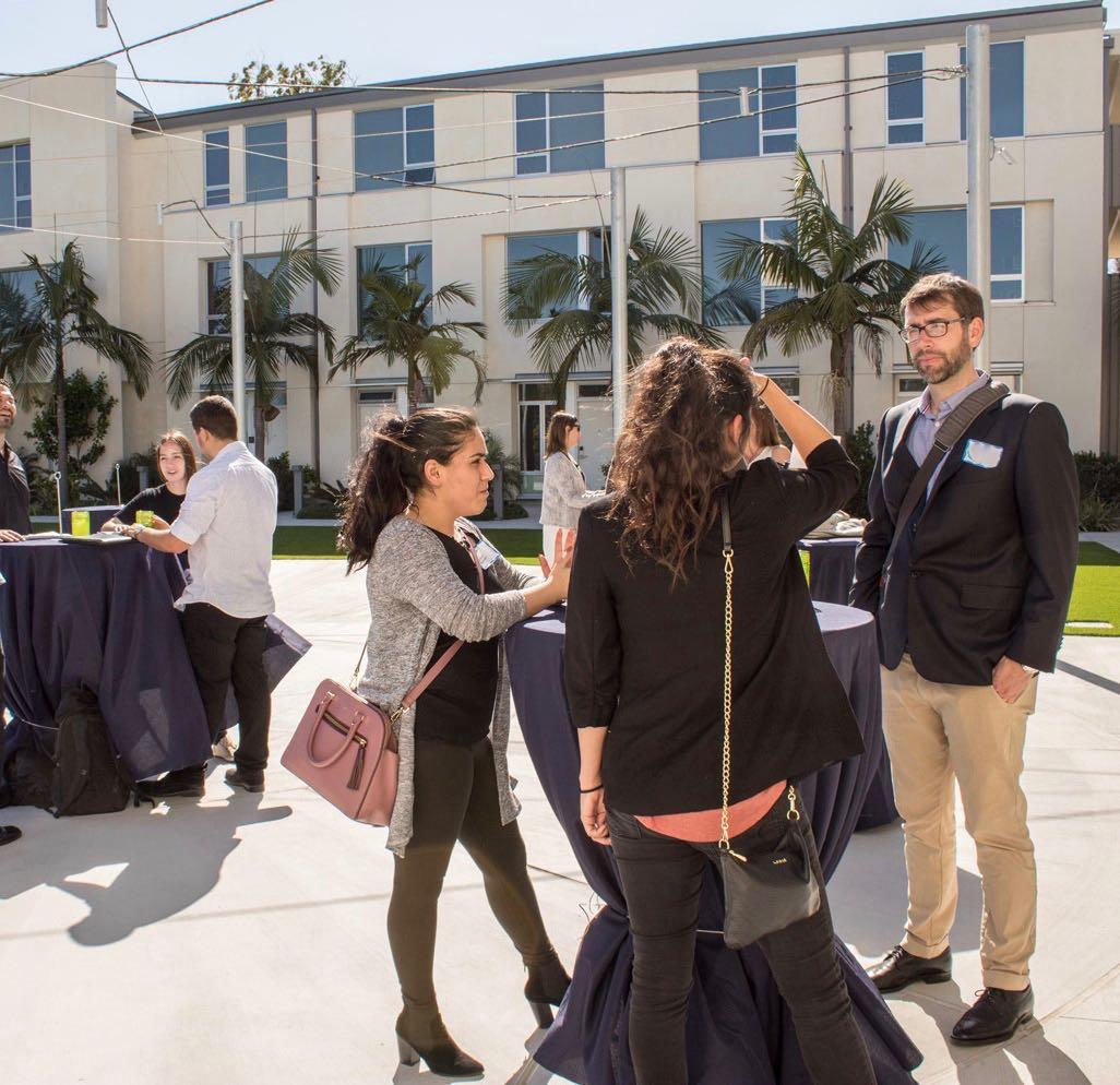 photo of grad student and recruiter speaking for recruitment events