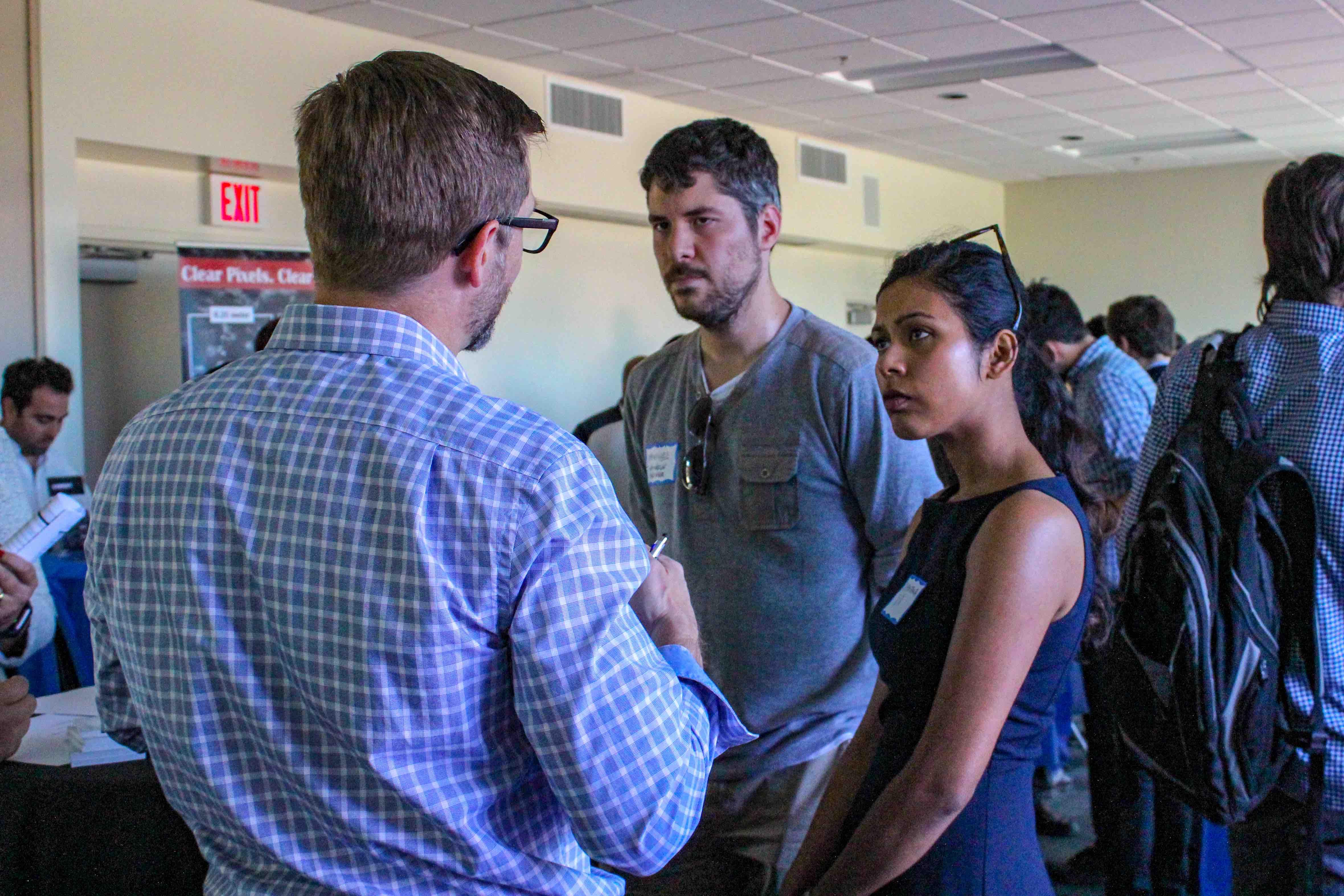 photo of student talking with academic faculty