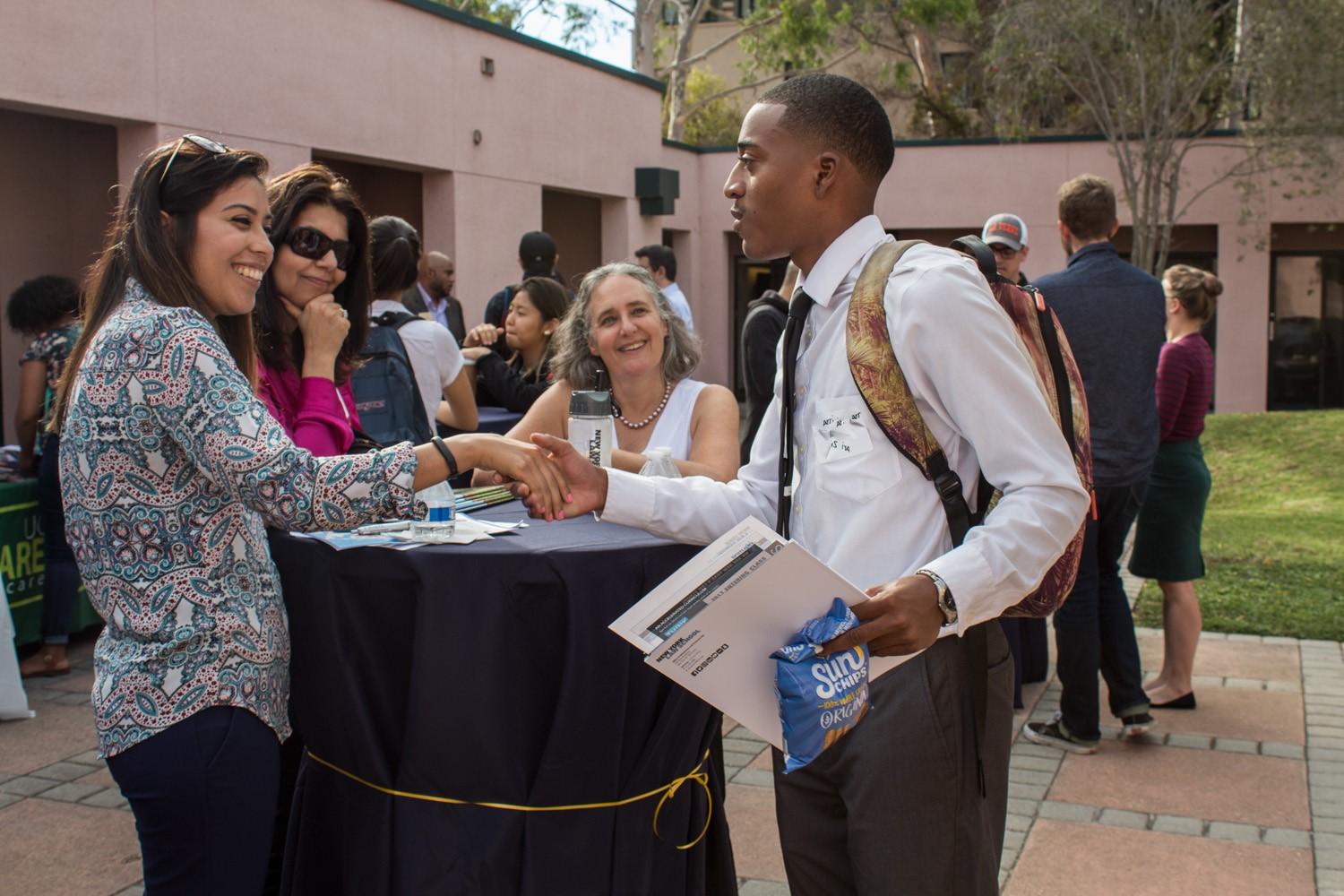 photo of UCSB student and grad school recruiter shaking hands for letters of rec