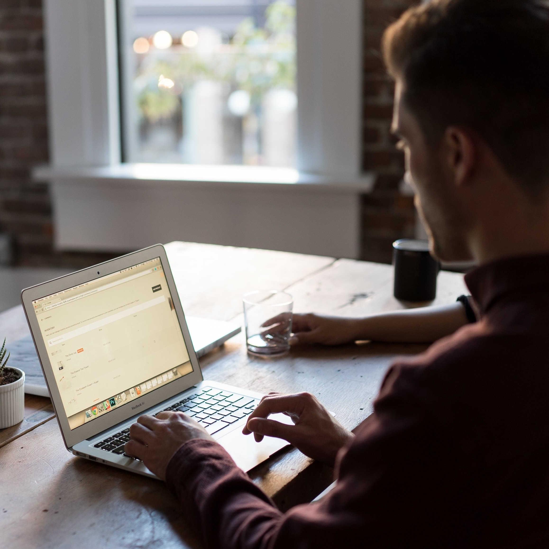 Person searching for jobs on laptop